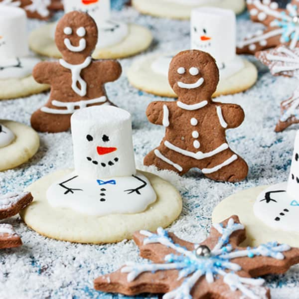 Gingerbread cookies and snowman cookies with marshmallows