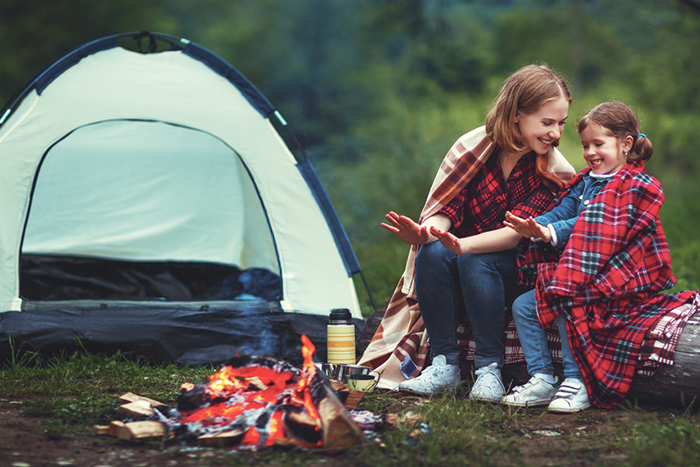 camping family fire and tent